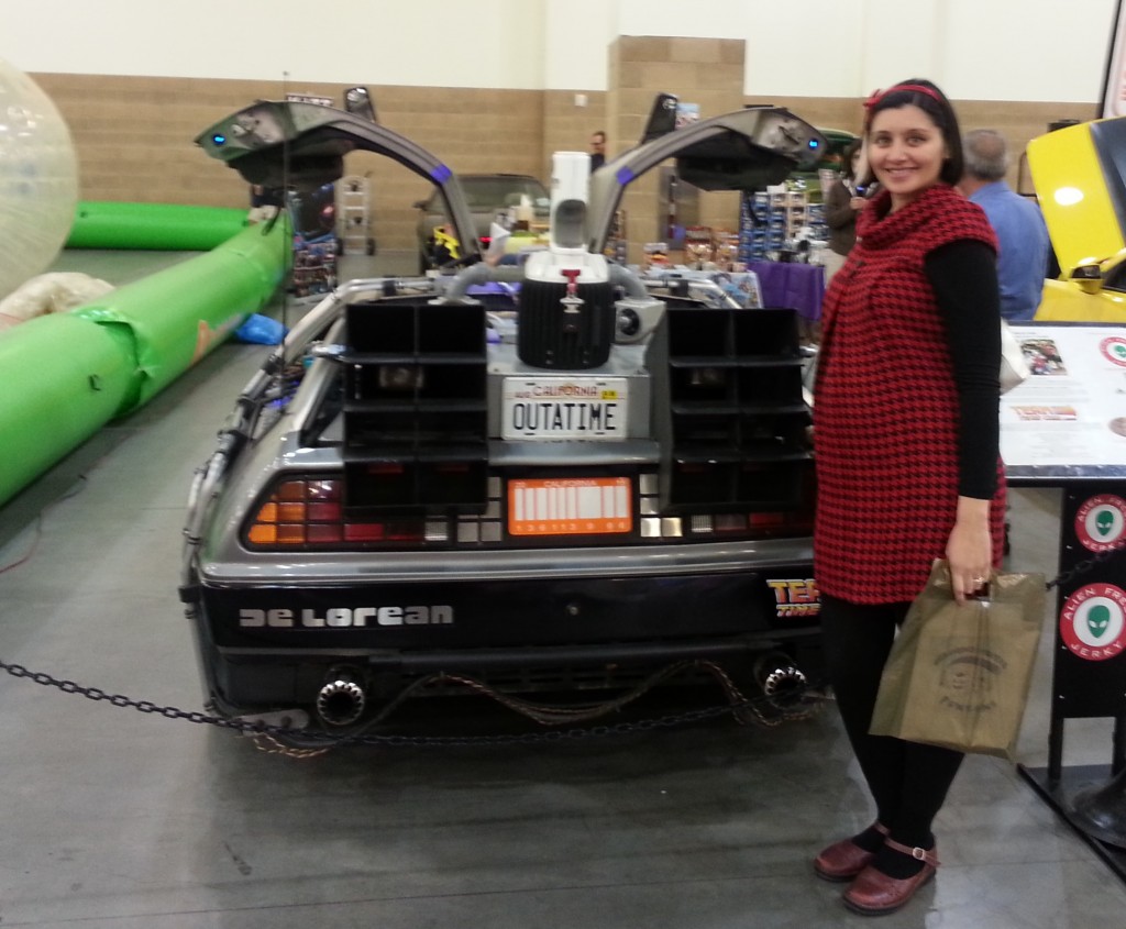 Simone with a belly! Baby boy Turkington poses with the De Lorean of what will the first of many times in his life.